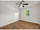 Bedroom features new wood-look flooring, a ceiling fan, and a window at 2313 Eleanor Dr, Shelby, NC 28150