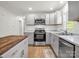 Bright kitchen with stainless steel appliances, subway tile backsplash, and plenty of cabinet space at 2313 Eleanor Dr, Shelby, NC 28150