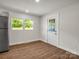 Bright living space featuring new laminate flooring, a fresh paint job, and modern lighting at 2313 Eleanor Dr, Shelby, NC 28150