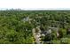 Aerial view of neighborhood with lush green trees, residential streets, and distant city skyline at 2925 Westfield Rd, Charlotte, NC 28209