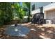 Backyard features a gravel area with a fire pit and steps to the upper deck at 2925 Westfield Rd, Charlotte, NC 28209