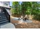 Inviting backyard fire pit area with gravel surround and comfortable seating for outdoor enjoyment at 2925 Westfield Rd, Charlotte, NC 28209