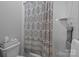 Full bathroom with a tub/shower combination and patterned shower curtain at 2925 Westfield Rd, Charlotte, NC 28209