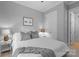 Cozy bedroom featuring a ceiling fan, neutral wall color and a comfortable bed at 2925 Westfield Rd, Charlotte, NC 28209
