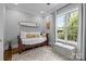 Bright bedroom features a comfy daybed, large window with backyard view and neutral carpet at 2925 Westfield Rd, Charlotte, NC 28209