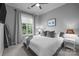 Comfortable bedroom with a large window that lets in lots of natural light and neutral wall color at 2925 Westfield Rd, Charlotte, NC 28209