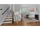 Elegant dining area with hardwood floors, chandelier, and large window at 2925 Westfield Rd, Charlotte, NC 28209