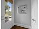 Bright entryway with a view to the outside, a mirror and a door leading to the outside at 2925 Westfield Rd, Charlotte, NC 28209