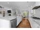 Open-concept kitchen with a large island, stainless steel appliances, and hardwood flooring at 2925 Westfield Rd, Charlotte, NC 28209