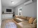 Living room with a kitchenette, comfortable sofa, hardwood flooring, and natural light at 2925 Westfield Rd, Charlotte, NC 28209