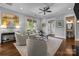 Bright living room features hardwood floors, neutral paint, lots of natural light, and stylish furnishings at 2925 Westfield Rd, Charlotte, NC 28209