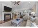 Spacious living room with fireplace, kitchen view, and comfortable seating, perfect for entertaining at 2925 Westfield Rd, Charlotte, NC 28209