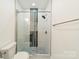 Stylish glass-enclosed shower features tile accents, modern fixtures and a showerhead at 322 S Hill St, Gastonia, NC 28052