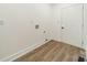 Neutral laundry room with hookups for washer and dryer at 322 S Hill St, Gastonia, NC 28052
