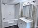 Bright bathroom featuring modern vanity, updated tiles, and a shower-tub combo at 341 Austin Dr, York, SC 29745