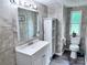 Nicely tiled bathroom featuring a toilet, vanity and built-in cabinet at 341 Austin Dr, York, SC 29745