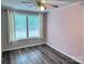 Bedroom with wood-look floors and natural light at 341 Austin Dr, York, SC 29745