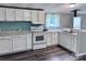 Well-lit kitchen with white cabinets, modern appliances, and sleek countertops at 341 Austin Dr, York, SC 29745