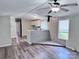 Open-concept living room offering a glimpse into the kitchen, enhanced by stylish flooring and natural light at 341 Austin Dr, York, SC 29745