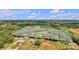 Aerial shot of a large parcel of land with a house, barns, outbuildings, and wooded area at 3440 17Th Ne Ave, Hickory, NC 28601