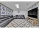 Finished basement with large sectional sofa, decorative lighting, and neutral colors at 3440 17Th Ne Ave, Hickory, NC 28601