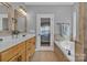 Elegant bathroom featuring a jetted tub, tiled shower, and double sinks at 3440 17Th Ne Ave, Hickory, NC 28601