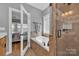 Elegant bathroom featuring a jetted tub, tiled shower, and neutral color palette at 3440 17Th Ne Ave, Hickory, NC 28601