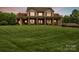 Charming two-story home with a welcoming front porch, decorative columns, and lush green lawn at 3440 17Th Ne Ave, Hickory, NC 28601