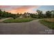 Stunning two-story home showcasing meticulously manicured landscaping and a lengthy driveway leading to the property at 3440 17Th Ne Ave, Hickory, NC 28601