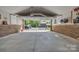 Spacious garage with concrete flooring, brick walls and a view of the property beyond at 3440 17Th Ne Ave, Hickory, NC 28601