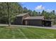 Large garage with attached carport and ample storage located in a wooded area at 3440 17Th Ne Ave, Hickory, NC 28601