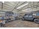 Spacious garage featuring shelving, ample storage, and a UTV inside the facility at 3440 17Th Ne Ave, Hickory, NC 28601