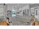 Bright kitchen showcasing granite counters, stainless appliances, white cabinetry, and breakfast bar seating at 3440 17Th Ne Ave, Hickory, NC 28601