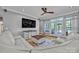 Spacious living room with comfortable white seating, hardwood floors, and a ceiling fan at 3440 17Th Ne Ave, Hickory, NC 28601
