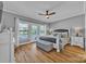 Serene primary bedroom with hardwood floors, a ceiling fan, and access to a private deck at 3440 17Th Ne Ave, Hickory, NC 28601