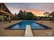 Inviting in-ground pool with diving board, poolside lounge, and covered seating area for relaxation at 3440 17Th Ne Ave, Hickory, NC 28601