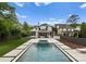 Beautiful backyard with in-ground pool, jacuzzi, and well-manicured lawn at 400 Hunter Ln, Charlotte, NC 28211