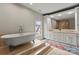 Bright bathroom featuring a soaking tub, tile floor and separate shower at 400 Hunter Ln, Charlotte, NC 28211