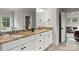 Bathroom features double sinks with granite countertops and a large mirror at 400 Hunter Ln, Charlotte, NC 28211