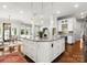 Open concept kitchen with a large island, breakfast bar, and pendant lighting at 400 Hunter Ln, Charlotte, NC 28211