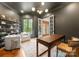 Sophisticated office with dark walls, built-in shelving, and ample natural light at 400 Hunter Ln, Charlotte, NC 28211