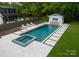 Aerial view of the in-ground pool, jacuzzi, and surrounding lounge area at 400 Hunter Ln, Charlotte, NC 28211