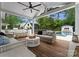 Covered porch featuring a ceiling fan, outdoor furniture, BBQ area, and swimming pool at 400 Hunter Ln, Charlotte, NC 28211