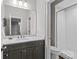 Modern bathroom features a large mirror, sleek vanity, and a tiled walk-in shower at 4030 City Homes Pl, Charlotte, NC 28209