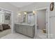 Spacious bathroom with double vanity, tile flooring, and separate water closet at 4030 City Homes Pl, Charlotte, NC 28209