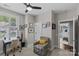 Bright bedroom featuring a desk, ceiling fan, and doorway leading to another room at 4030 City Homes Pl, Charlotte, NC 28209