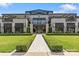 Exterior view of retail building with landscaped walkway and sophisticated architectural details at 4030 City Homes Pl, Charlotte, NC 28209