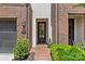Charming front entrance with brick walkway, black door, and manicured landscaping; number 4030 displayed at 4030 City Homes Pl, Charlotte, NC 28209