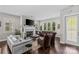 Open-concept living room with fireplace, hardwood floors, and ample seating at 4030 City Homes Pl, Charlotte, NC 28209
