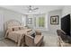 Comfortable main bedroom featuring a bay window, neutral decor, and ample natural light at 4030 City Homes Pl, Charlotte, NC 28209
